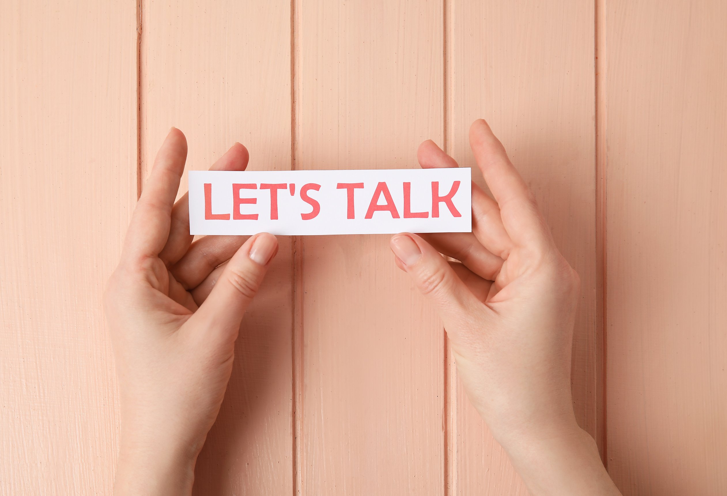 Woman and Paper with Text LET'S TALK on Color Wooden Background